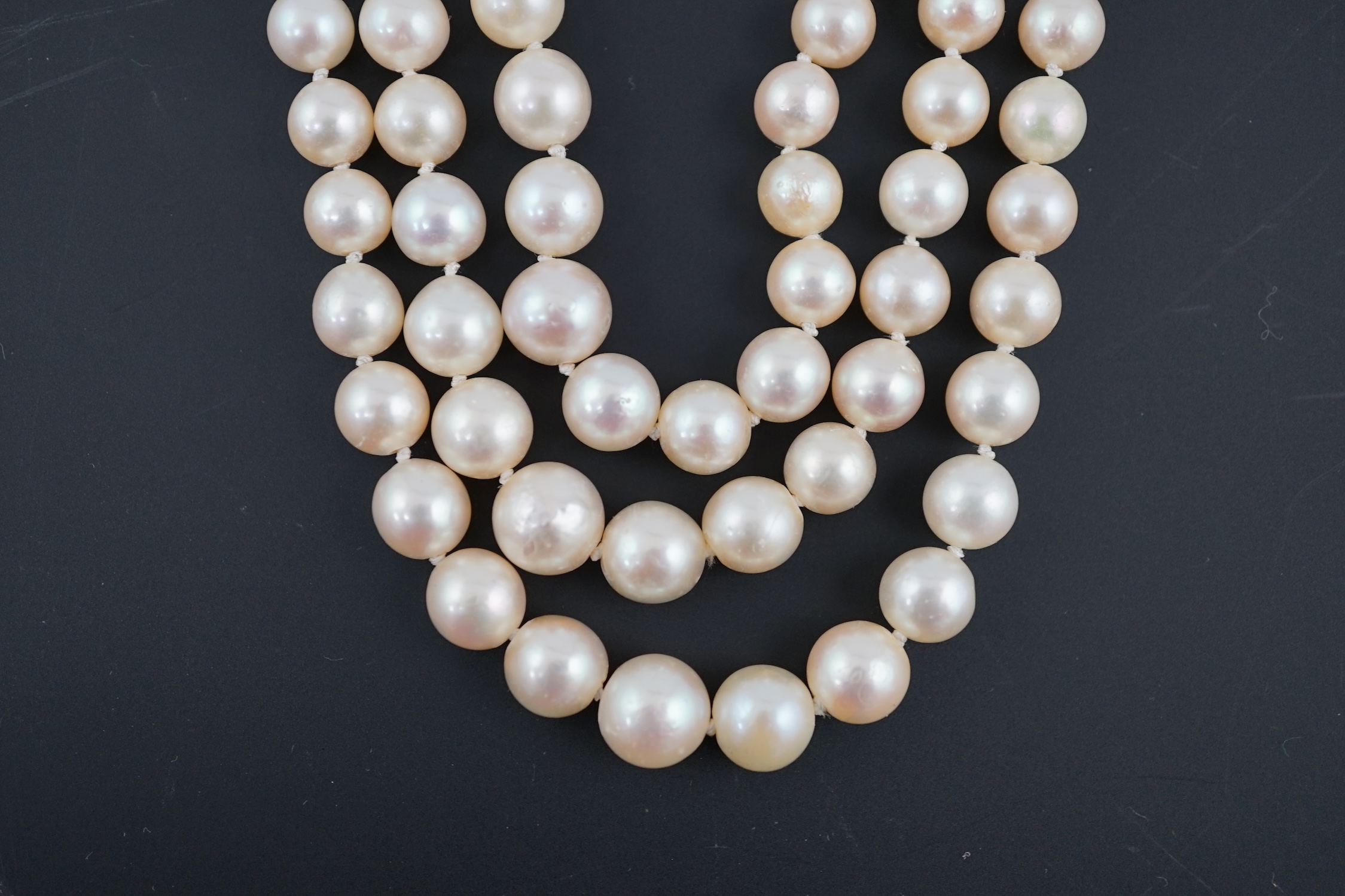 A triple strand graduated cultured pearl choker necklace, with old and rose cut diamond cluster set circular clasp
